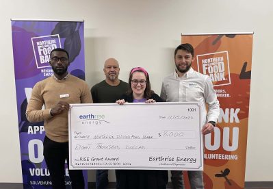 Earthrise Energy employees present a check to Jennifer Ackerman of the Northern Illinois Food Bank.
